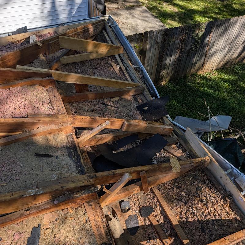 Roof wood framing removed for tree damage repair