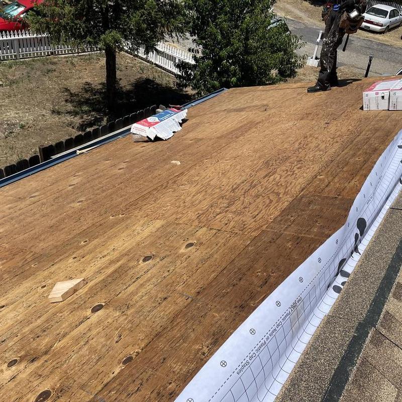 Plywood roof decking installation on residential roof