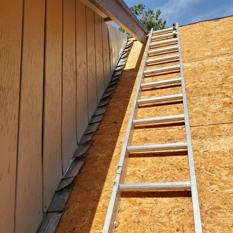 GAF asphalt roof decking with ladder on cabin