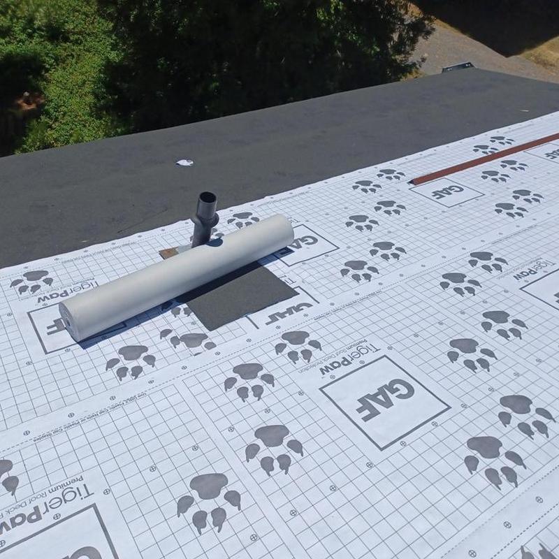 Asphalt roof underlayment with ventilation pipe installation
