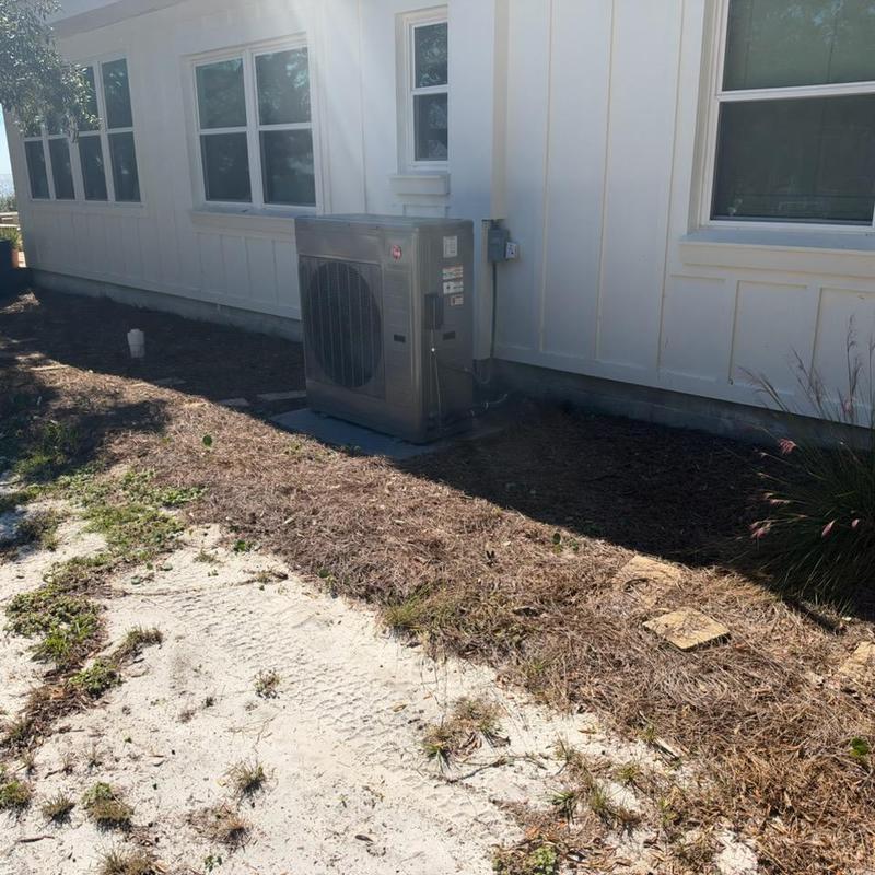Heat pump unit outside home with new whole home filter
