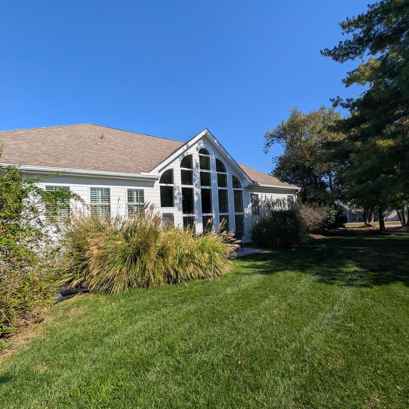 Atrium window replacement and siding upgrade on house exterior