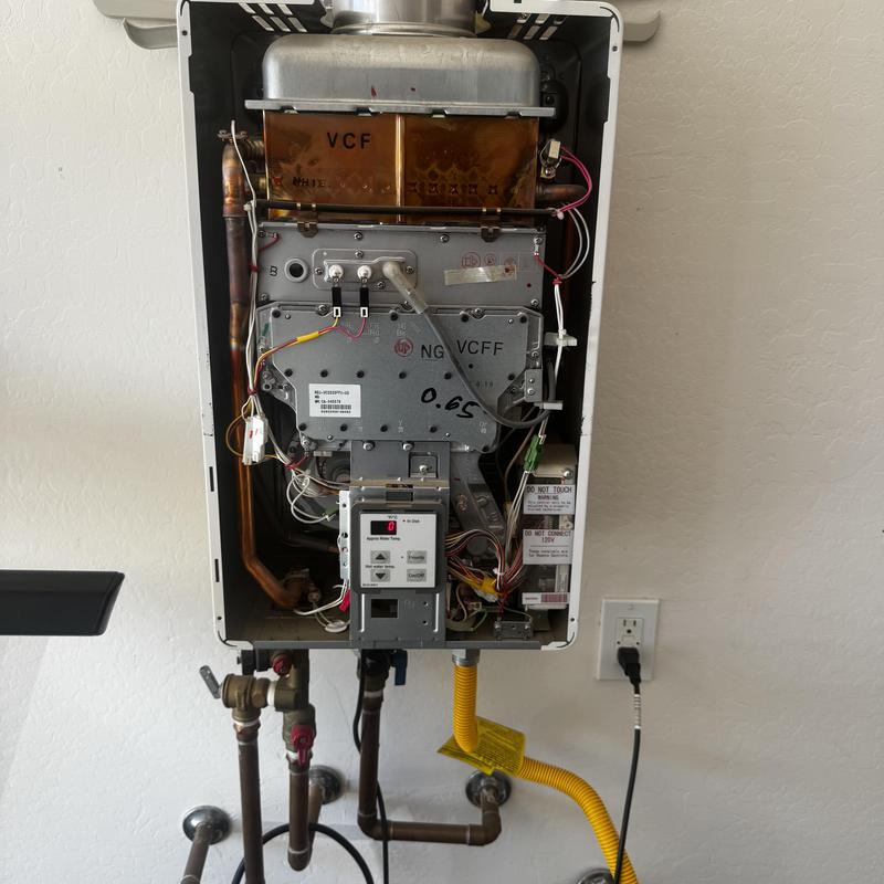 Rinnai tankless water heater internal components exposed