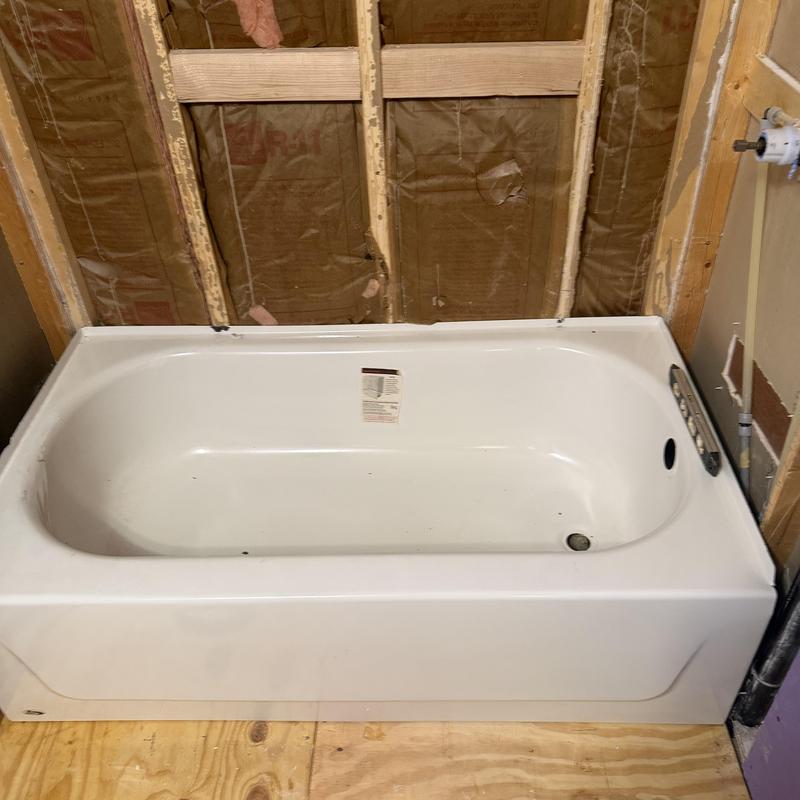 Tub shower unit installation with drain and valve setup Tub shower unit installation with drain and valve setup