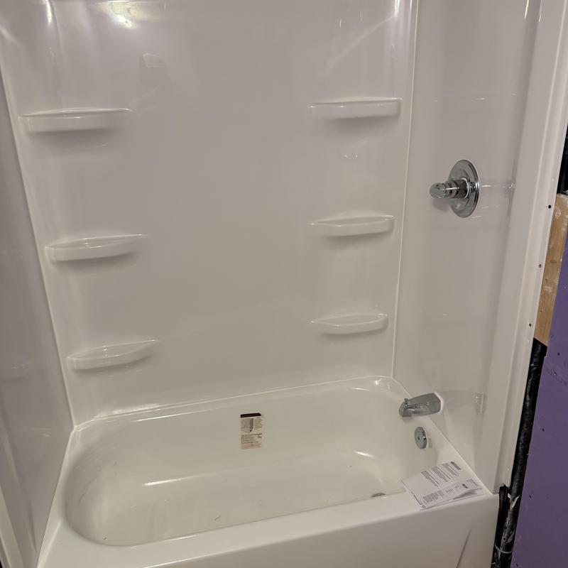 Tub shower with surround and new trim installed Tub shower with surround and new trim installed