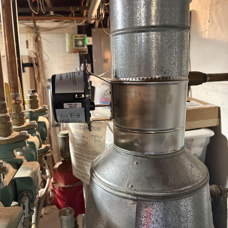 Flue damper motor on boiler in basement setup