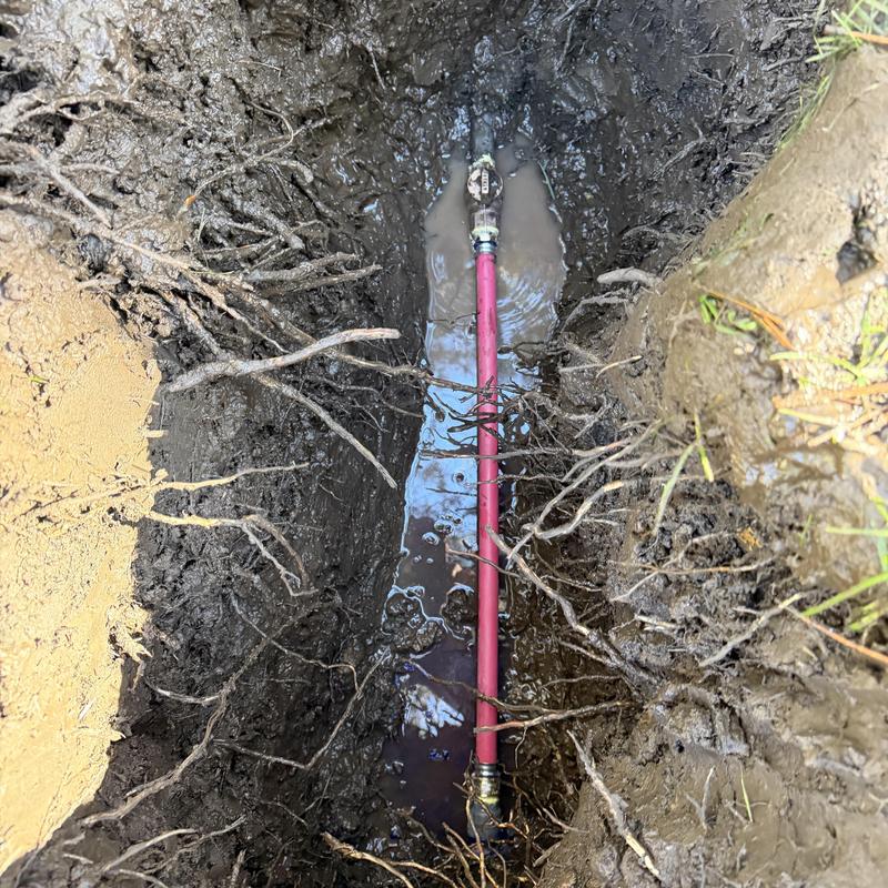PVC pipe and valve replacement in muddy trench PVC pipe and valve replacement in muddy trench