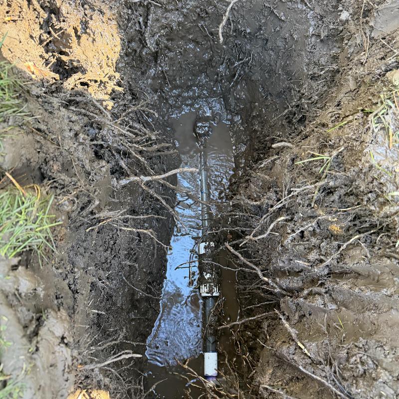Yard hydrant PVC pipe and stop valve in muddy trench Yard hydrant PVC pipe and stop valve in muddy trench