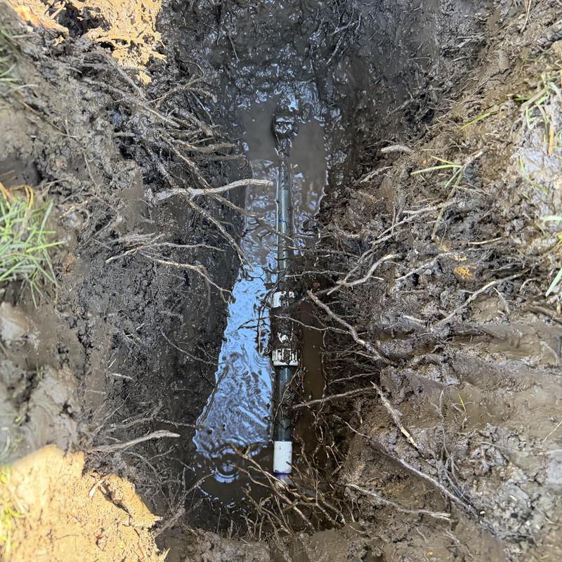 PVC pipe and valve replacement in muddy trench PVC pipe and valve replacement in muddy trench