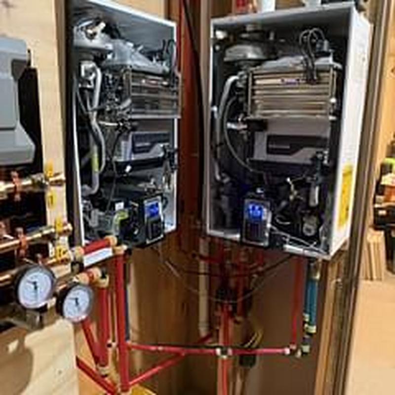 Tankless water heater system with gas pressure gauges