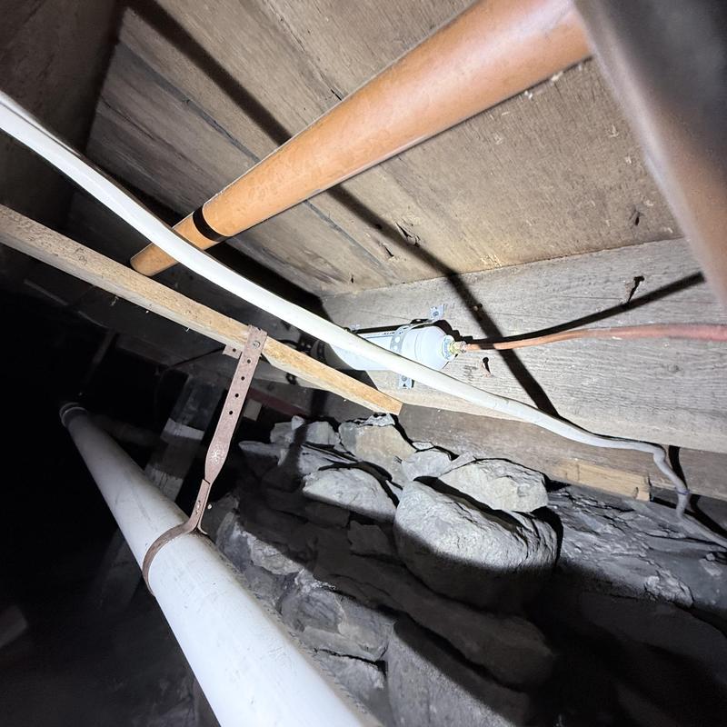 Icemaker water filter installation under wooden floor joists