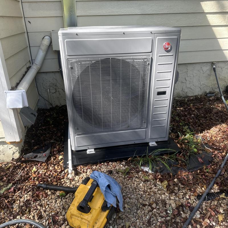 Heat pump outdoor unit with maintenance tools nearby