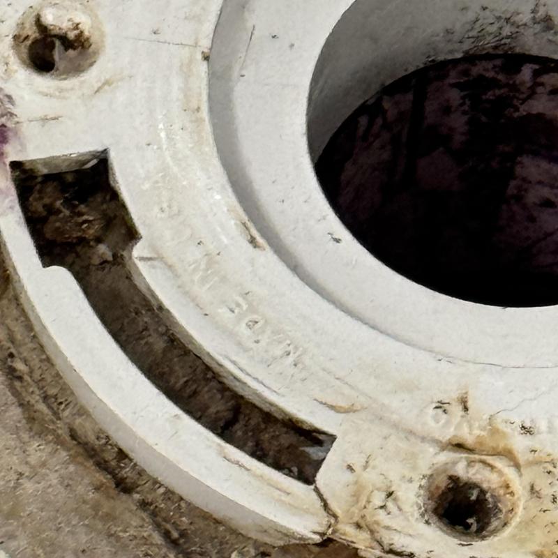 Toilet flange with cracked sides and bolt holes Toilet flange with cracked sides and bolt holes