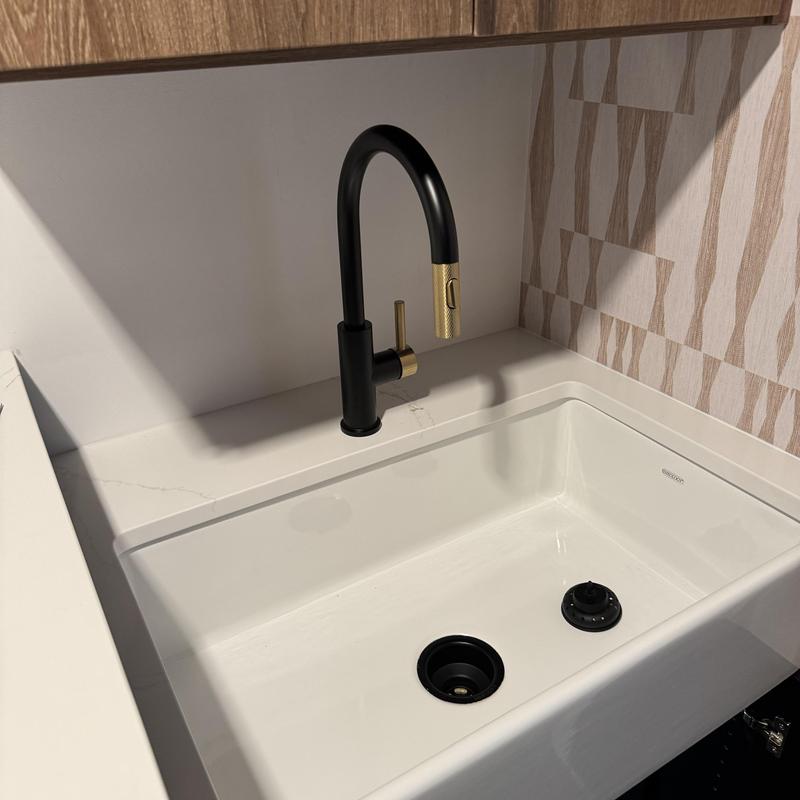 Laundry sink with black and gold faucet installation Laundry sink with black and gold faucet installation