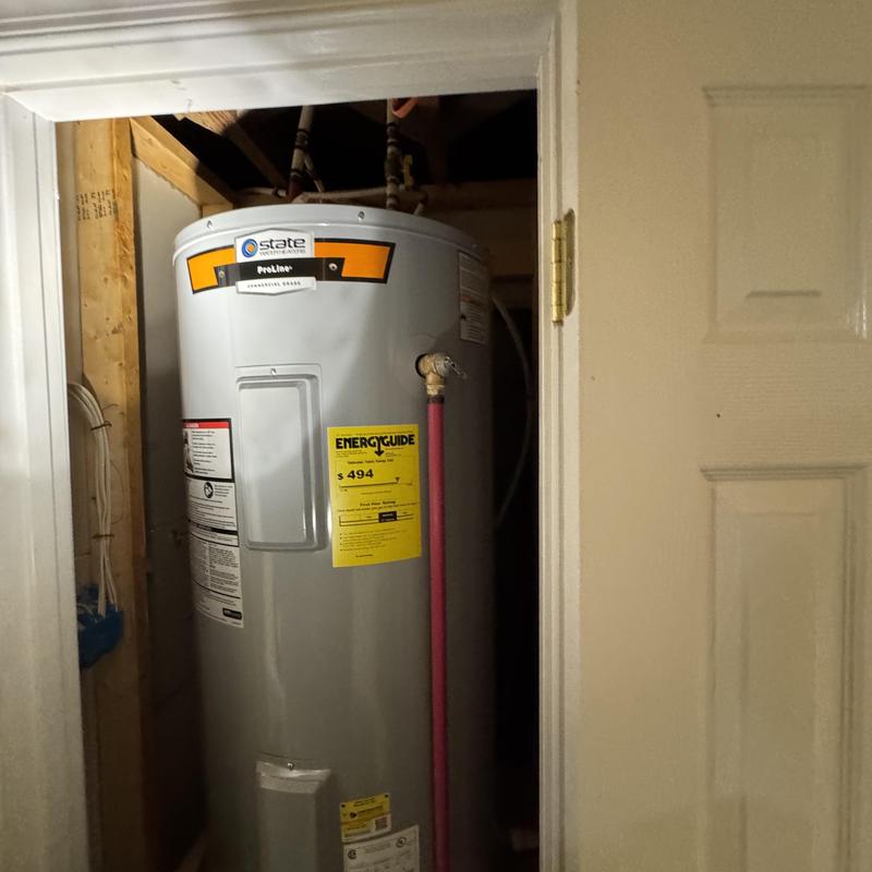 Electric water heater installation in utility closet Electric water heater installation in utility closet