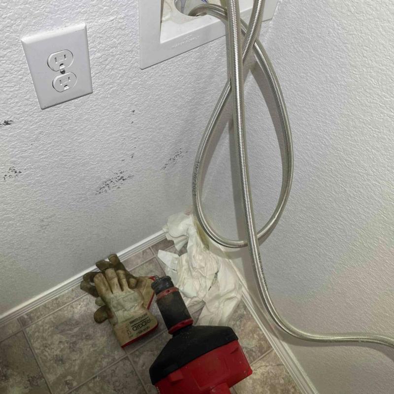 Washer drain line with cleaning cable and gloves Washer drain line with cleaning cable and gloves