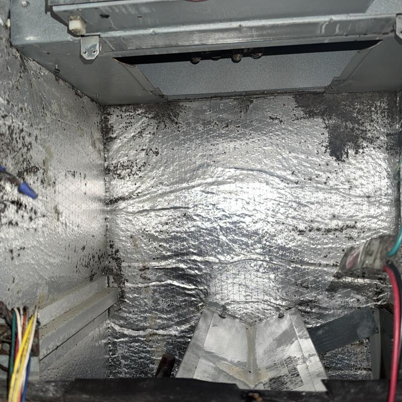 Blower wheel compartment with dirt buildup in split system