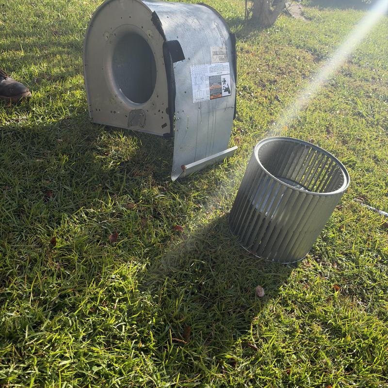 Blower wheel and housing removed for cleaning outdoors