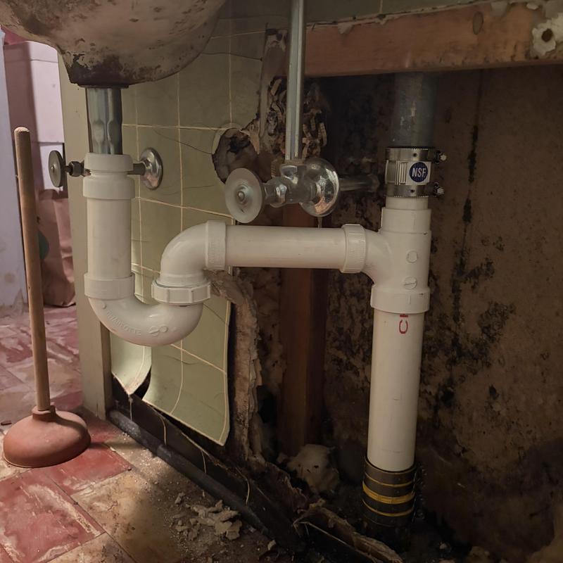 Bathroom sink drain and PVC pipe replacement under sink