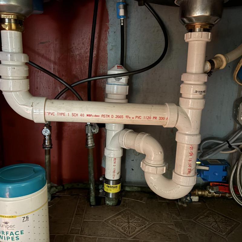 PVC kitchen sink drain pipe replacement under sink